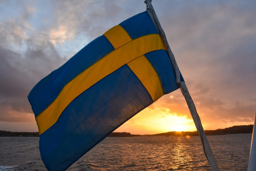 Swedish flag against sunset.jpg