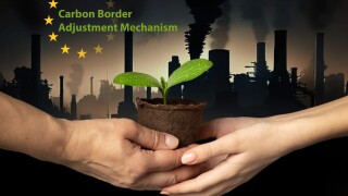 EU Carbon Border Adjustment Mechanism. Ecology. Hands of adult and child hold peat pot with green sprout of plant against backdrop of industrial cityscape with smoking chimneys and dark sky. CBAM.