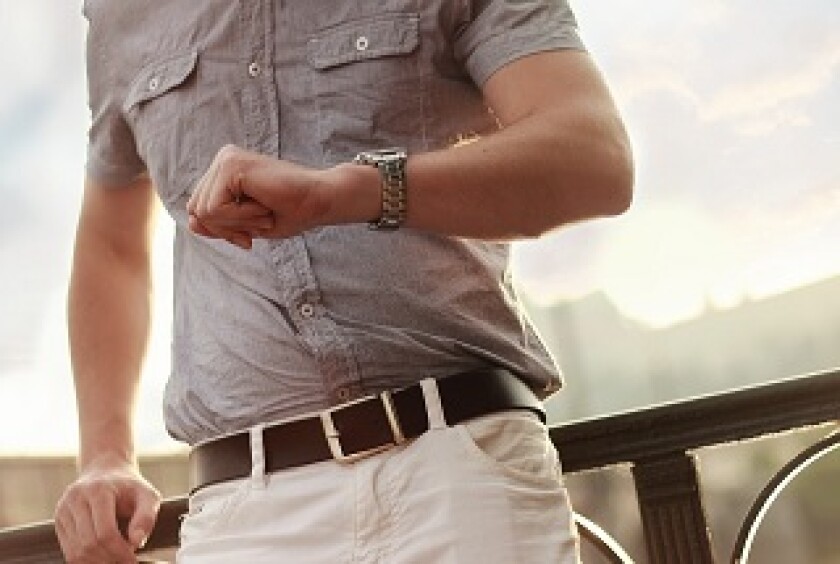 Man wearing designer watch