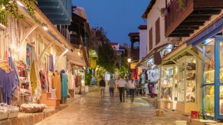 Street view in the Kas old town with boutique shops at evening, Turkey