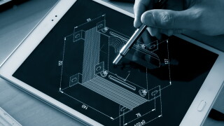 engineer working on computer on electrical piece design