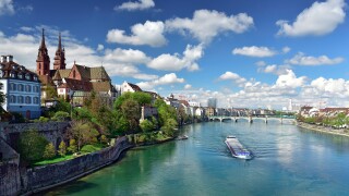 Old town with Basler Muenster Cathedral on the banks of the Rhine river. Basel, Switzerland.