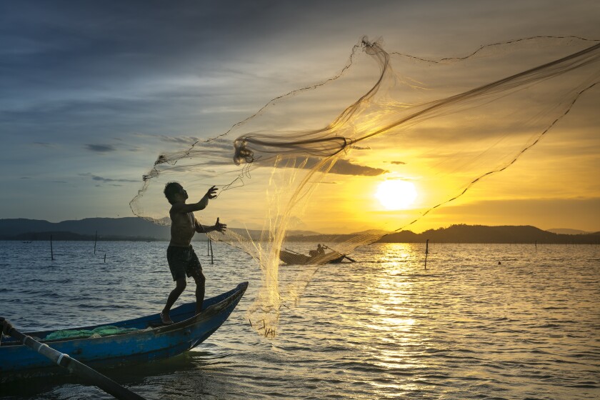 Fisherman casting net