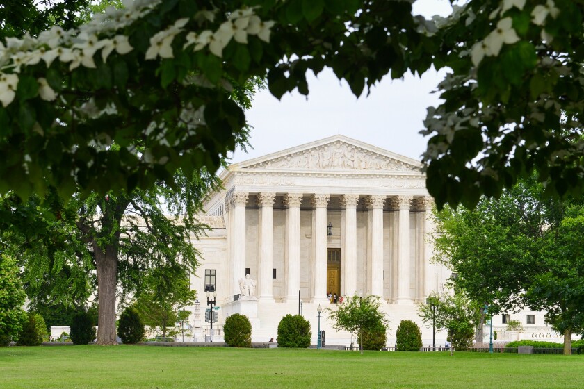 Supreme Court Building in the frame of green leaves - Washington
