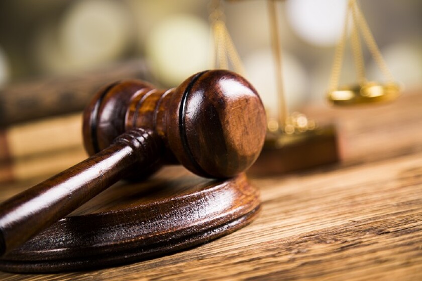Golden scales of justice, books, Statue of Lady Justice. Owl and