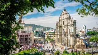 Ruins of Saint Paul's Catholic Church with tourists. They are one of Macau's famous landmarks.