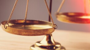 Small gold nuggets in an antique measuring scale