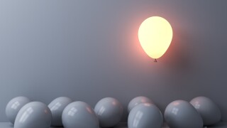Stand out from the crowd and different concepts One light balloon glowing and floating above other white balloons on white wall background with window reflections and shadows 3D rendering