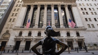 Fearless Girl sculpture in front of New York Stock Exchange buil