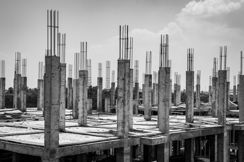 Columns under construction in Yangon outskirts, black and white image