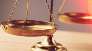 Small gold nuggets in an antique measuring scale