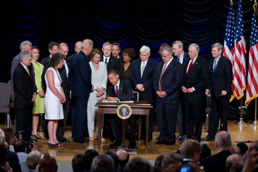 President Barack Obama signs in the Dodd-Frank Wall Street Reform and Consumer Protection Act in July 2010