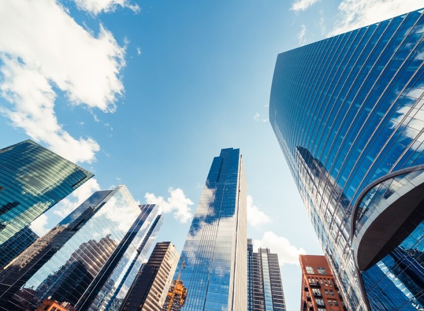 Modern tower buildings or skyscrapers in financial district with cloud on sunny day in Chicago, USA. Construction industry, business enterprise organization, or communication technology concept