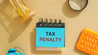 Notes with the words Tax Penalty. Underpayment of estimated tax by person, financial institution or business. Taxation. Finance concept. Fine