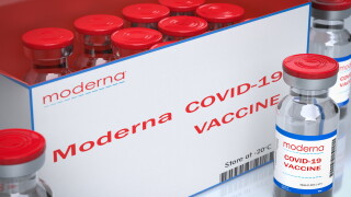 Italy - January, 5, 2021: Moderna Inc produces the vaccine against the COVID-19 virus. Vaccine bottles effective in preventing 95 of Coronavirus Covid-19 infections