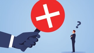 Error message sign prohibiting businessmen from passing