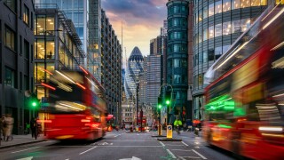 Sunset at the City of London, England, with street traffic light