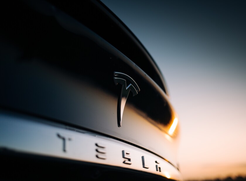 Tesla Model X P100D interior logo at the rear trunk. Elon Musk Tesla motor company bage and logo at the rear part of a car 