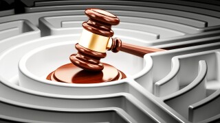 Gavel inside labyrinth maze. 3D rendering