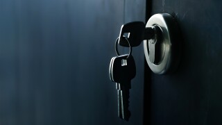 Selective focus/Keys stuck in a lock with door.