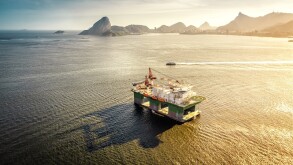 Oil drilling rig against panorama of Rio De Janeiro, Brazil