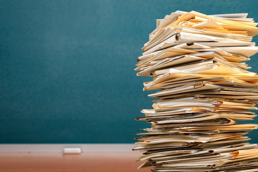 Stack file folders with documents on the desk