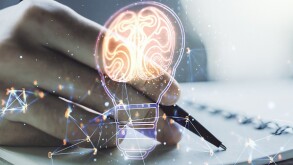Creative light bulb illustration with human brain and with man hand writing in diary on background, future technology concept. Multiexposure