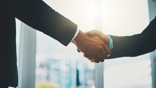 Business people, meeting and shaking hands for introduction, support and advice at law firm consultation. Lawyer, attorney or advisor with handshake for client deal, merger and welcome to partnership