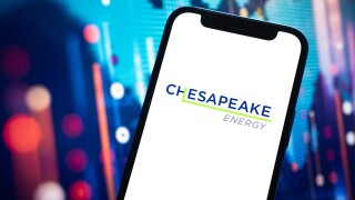 Index of Chesapeake Energy oil prices, logo close-up. Petroleum stock market graphs, global financial background. Gasoline, energy and diesel industry concept