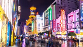 SHANGHAI, CHINA - DEC 22, 2019 : Nanjing Road is the main shopping streets of Shanghai, Neon signs light on Nanjing Road. The area is the main shopping one of the world's busiest shopping streets.