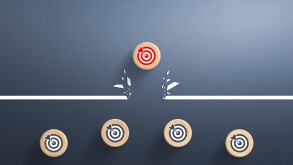 Target icon on wooden cube breaking through obstacle, Concept of overcoming barriers, goal