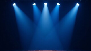Blue spotlights shining on dark background, illuminating stage, background, spotlights, dark