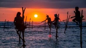 Traditional stilt fisherman at sunset in Sri Lanka