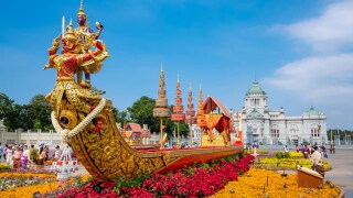 Statue of a boat surrounded by flowers in Bangkok, Thailand