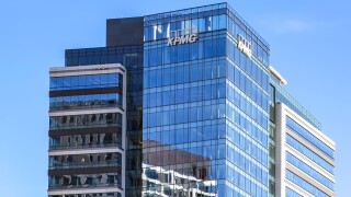 Tysons Corner, Virginia, USA- March 1, 2020: Sign of KPMG on the building in Tysons Corner, Virginia, USA. KPMG is a professional service company and one of the Big Four auditors, Seated in Netherland