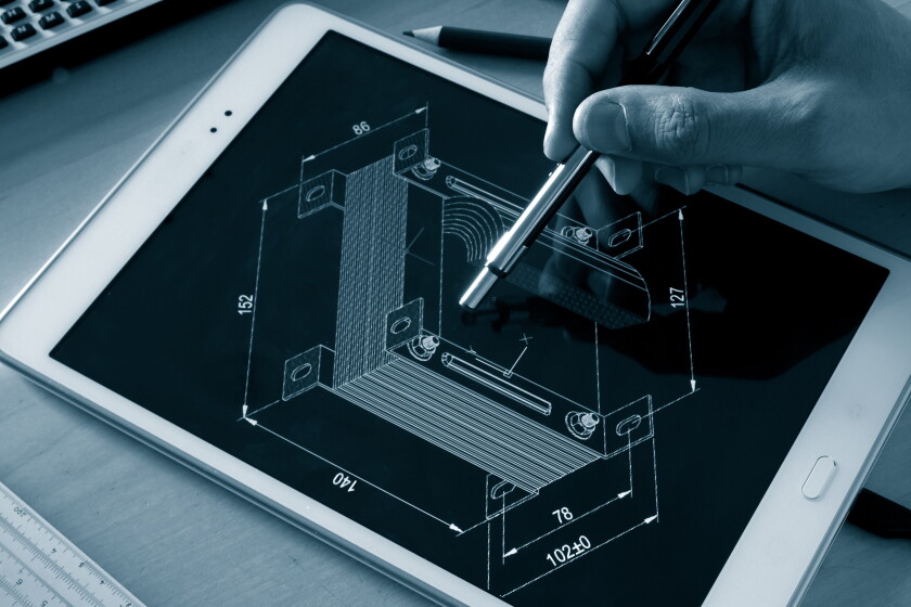 engineer working on computer on electrical piece design