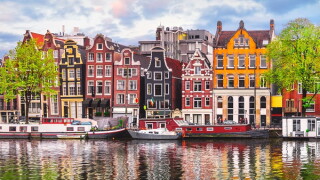 Amsterdam Netherlands dancing houses over river Amstel landmark