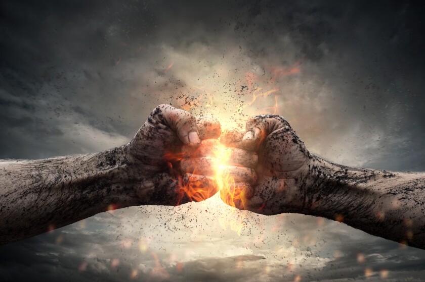 Fight, close up of two fists hitting each other over dramatic sk