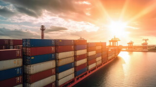Container ship carrying container box in import export with quay