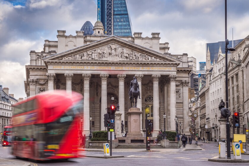 London, England - Iconic red double decker busses on the move an