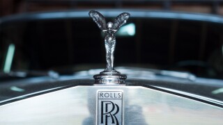 closeup of Rolls Royce logo on car