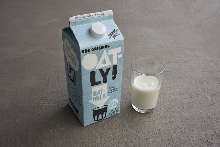 Portland, Oregon, USA - Sep 6, 2019: Oatly brand oak milk on grey background. Oatly is a Swedish oat drink company.
