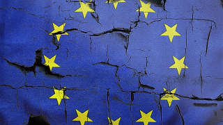 EU flag on crumbling background