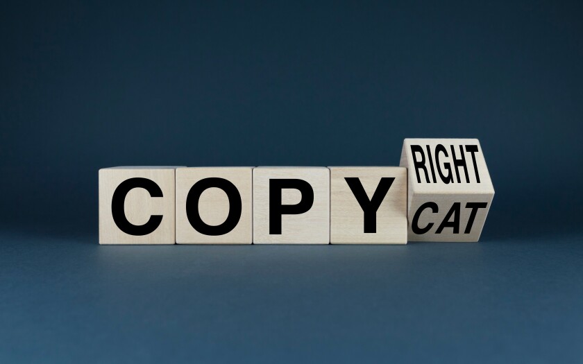 Cubes form words Copycat or copyright. Business Concept