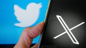 Lviv Ukraine  -  23 07 23: mobile phone with new logo X for twitter on blue background with white bird, Elon Musk vows to ditch bird logo