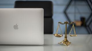 Scales of justice and laptop.jpg