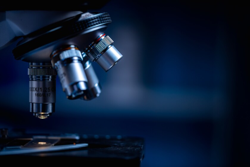 Closeup of Scientific microscope data analysis in the laboratory