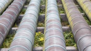 Close-up of water pipes of an hydro electric power plant. Symbol for environment-friendly electricity and power generation.