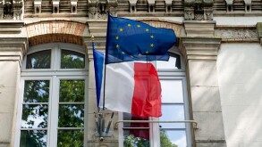 French and EU European Union flags fluttering on the city hall i