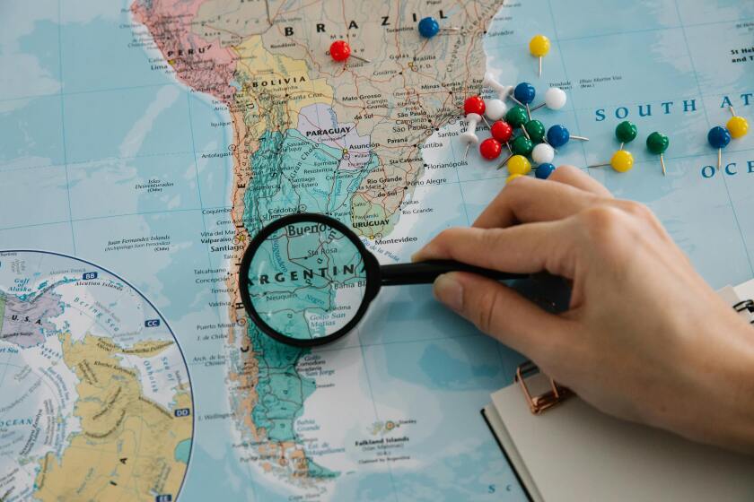 Magnifying glass focusing on a map of South America.jpg